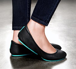 Tieks with their classic teal sole